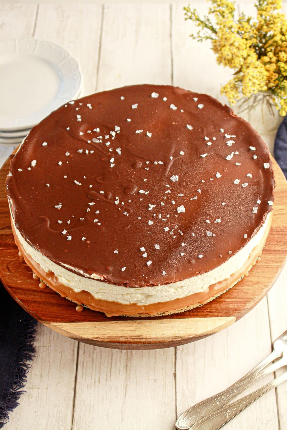 Millionaire Cheesecake on a wooden cutting board.