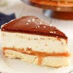 Slice of millionaire cheesecake on a plate.