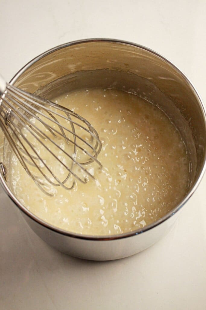 Caramel being made in a saucepan.