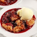 Mixed berry cobbler on a small plate.