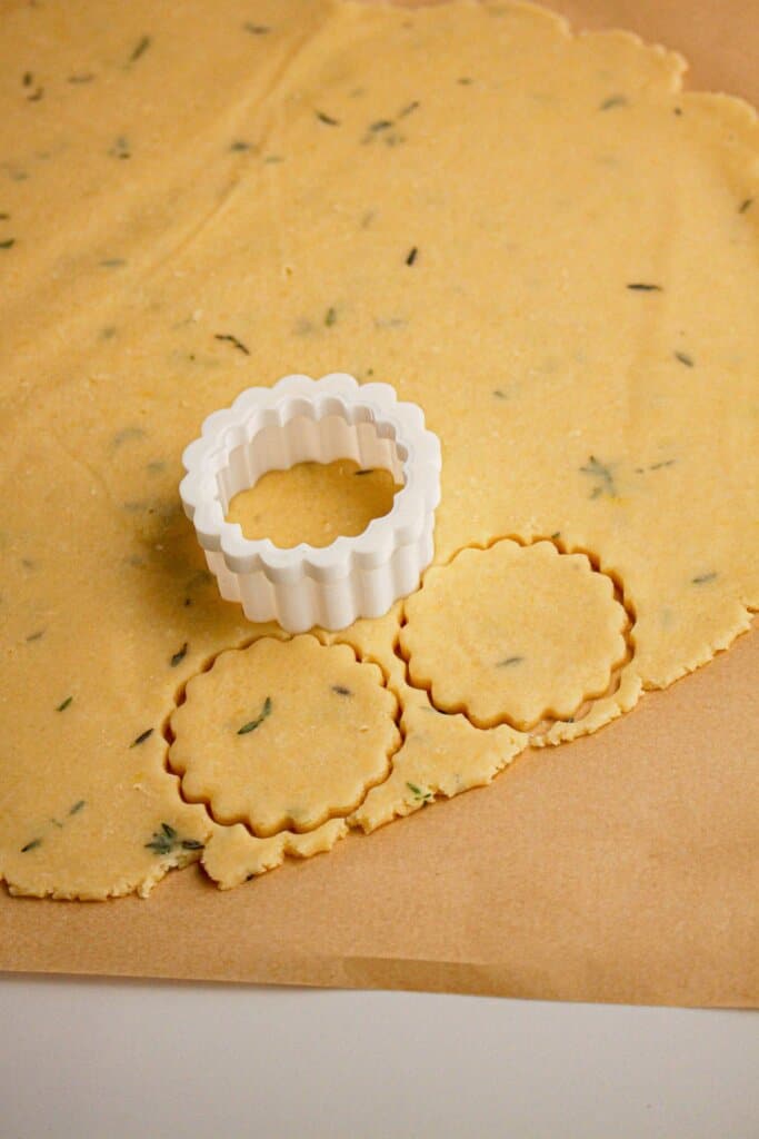 Dough being cut on a counter.