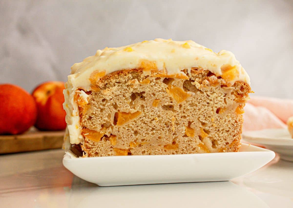 Peach bread slices on a square plate.