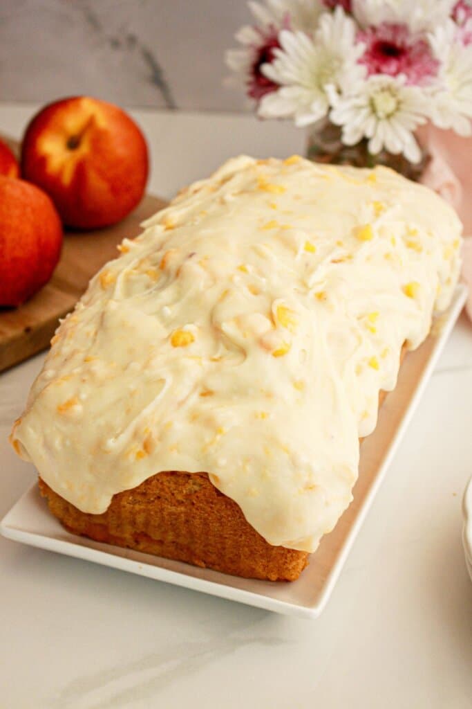 Peach bread slices on a square plate.