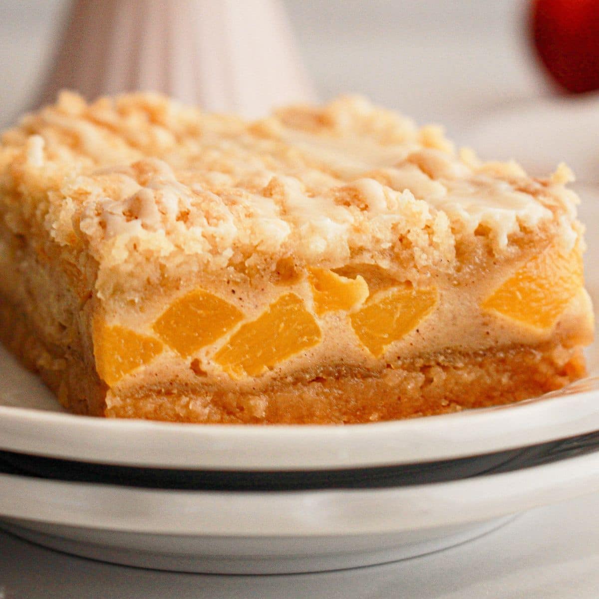 Peach pie bar on a plate.