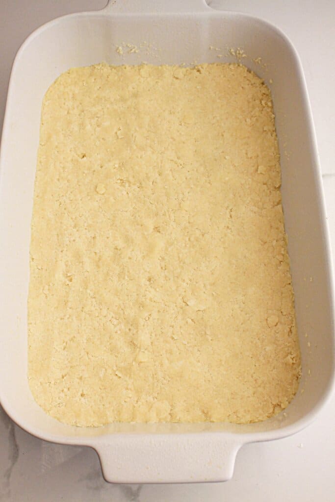 Crust pressed into the bottom of the baking dish.