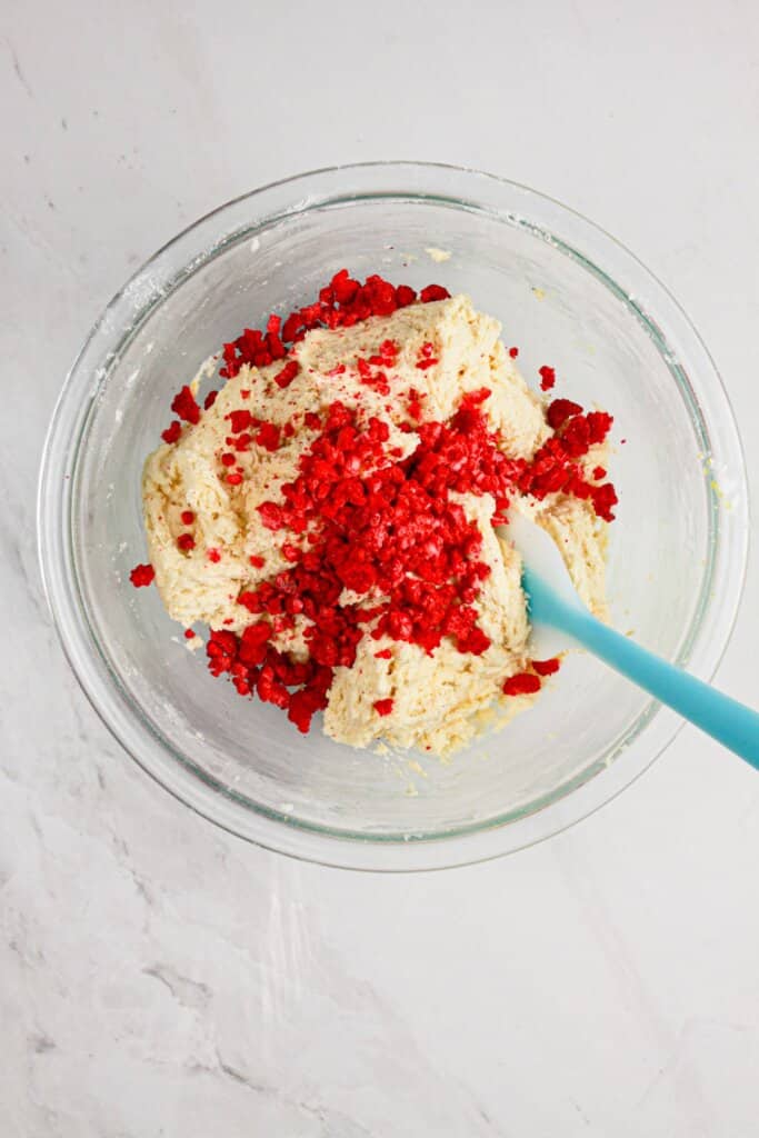 Freeze dried berries being added to dough.