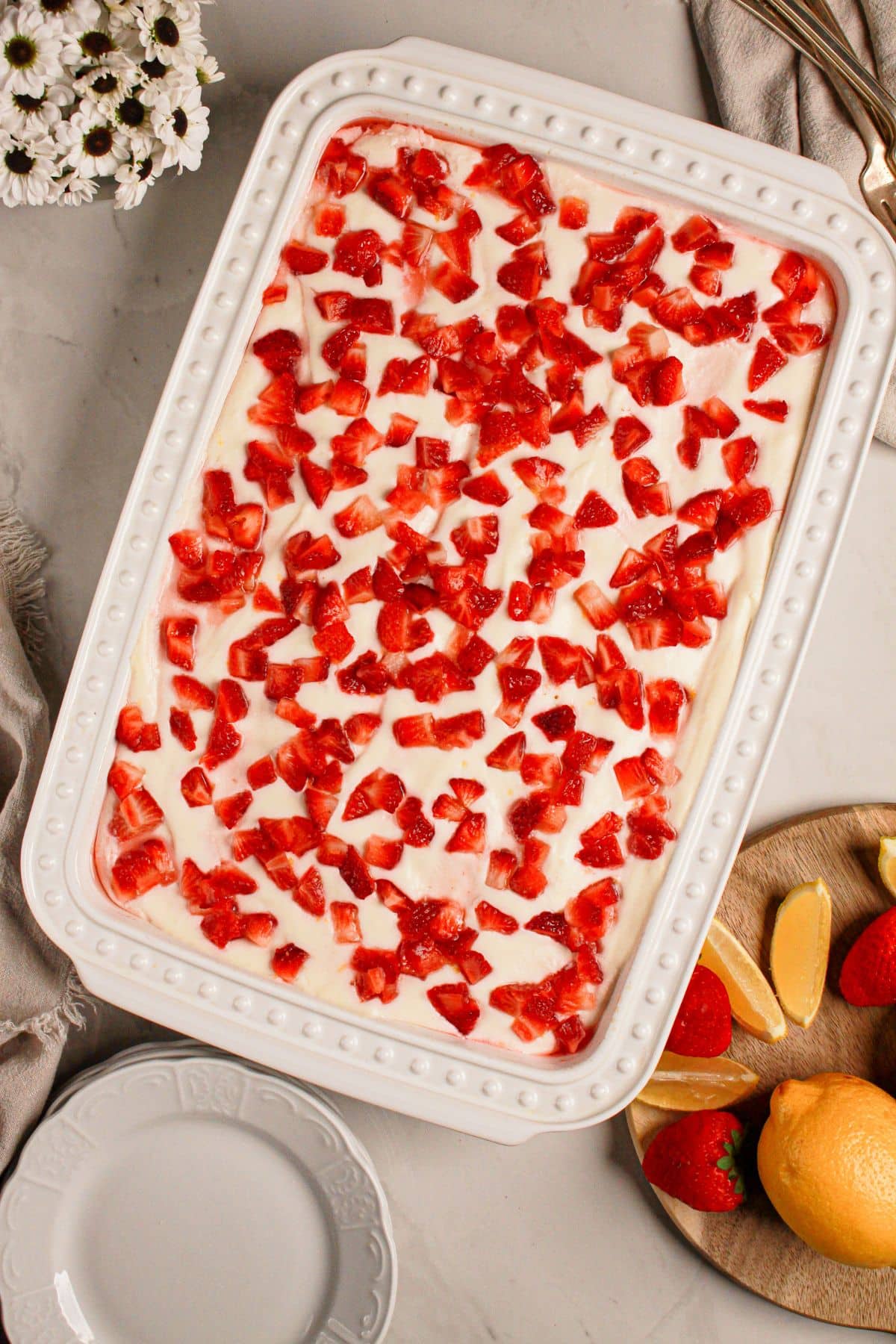 White baking dish filled with cake.