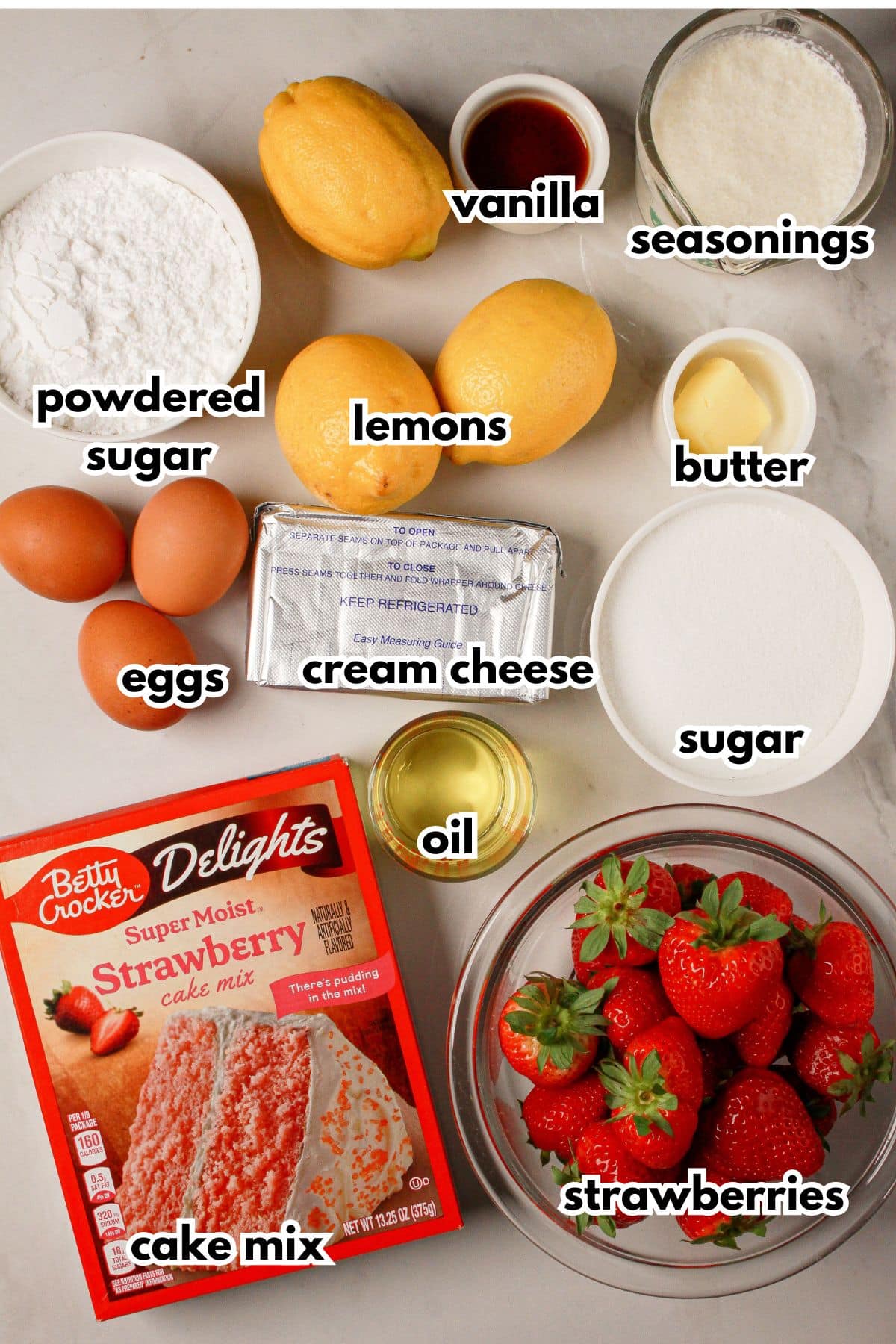Bowls of ingredients labelled with text on a counter.