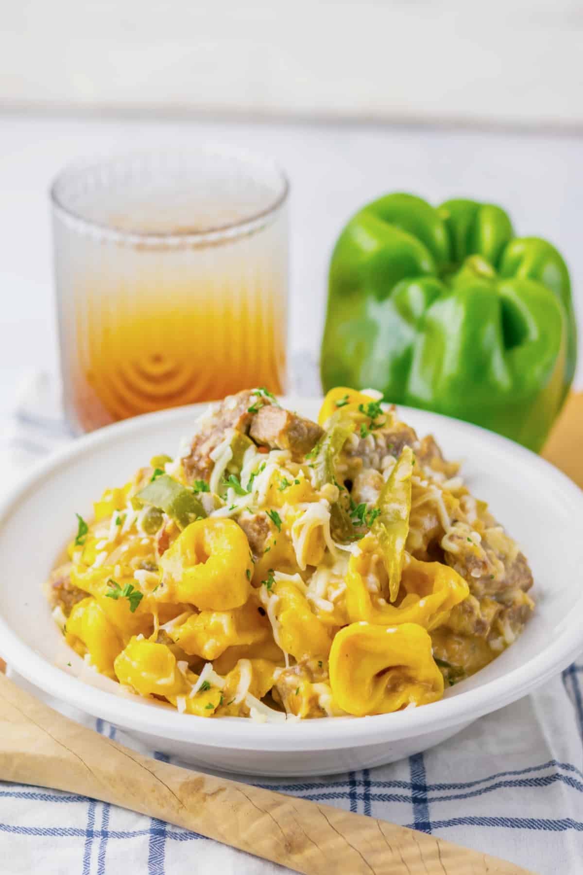 Bowl of cheesesteak tortellini on a counter.