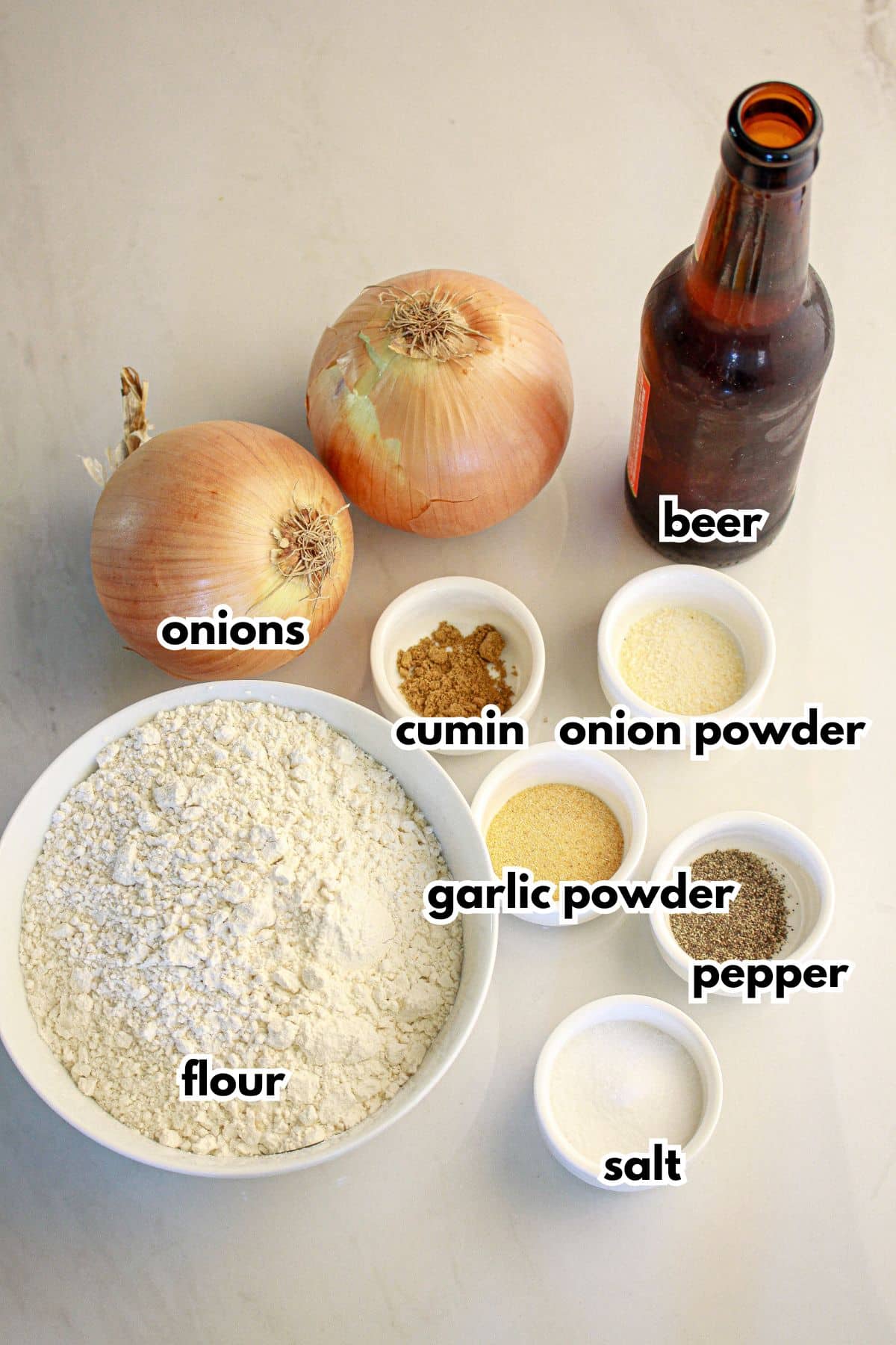 Bowls of ingredients on a counter labelled with text.