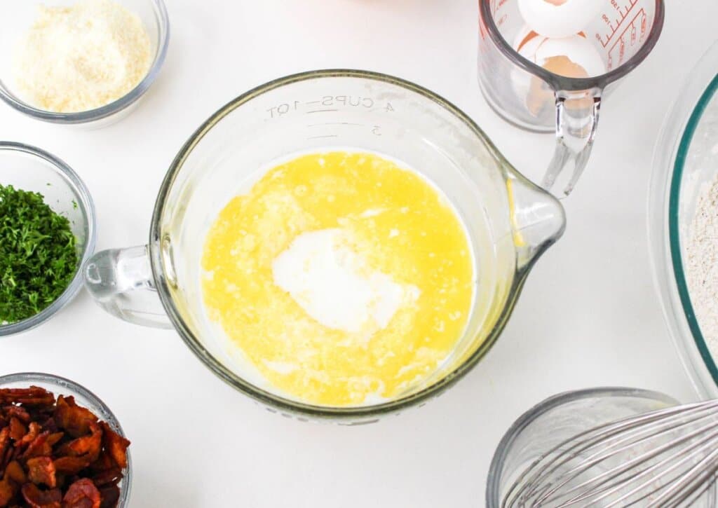 Wet ingredients being mixed in a bowl.