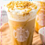 Caramel ribbon crunch Frappuccino in a plastic cup.