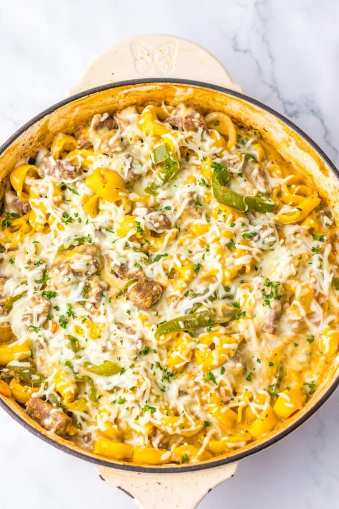 Pot full of pasta and veggies.