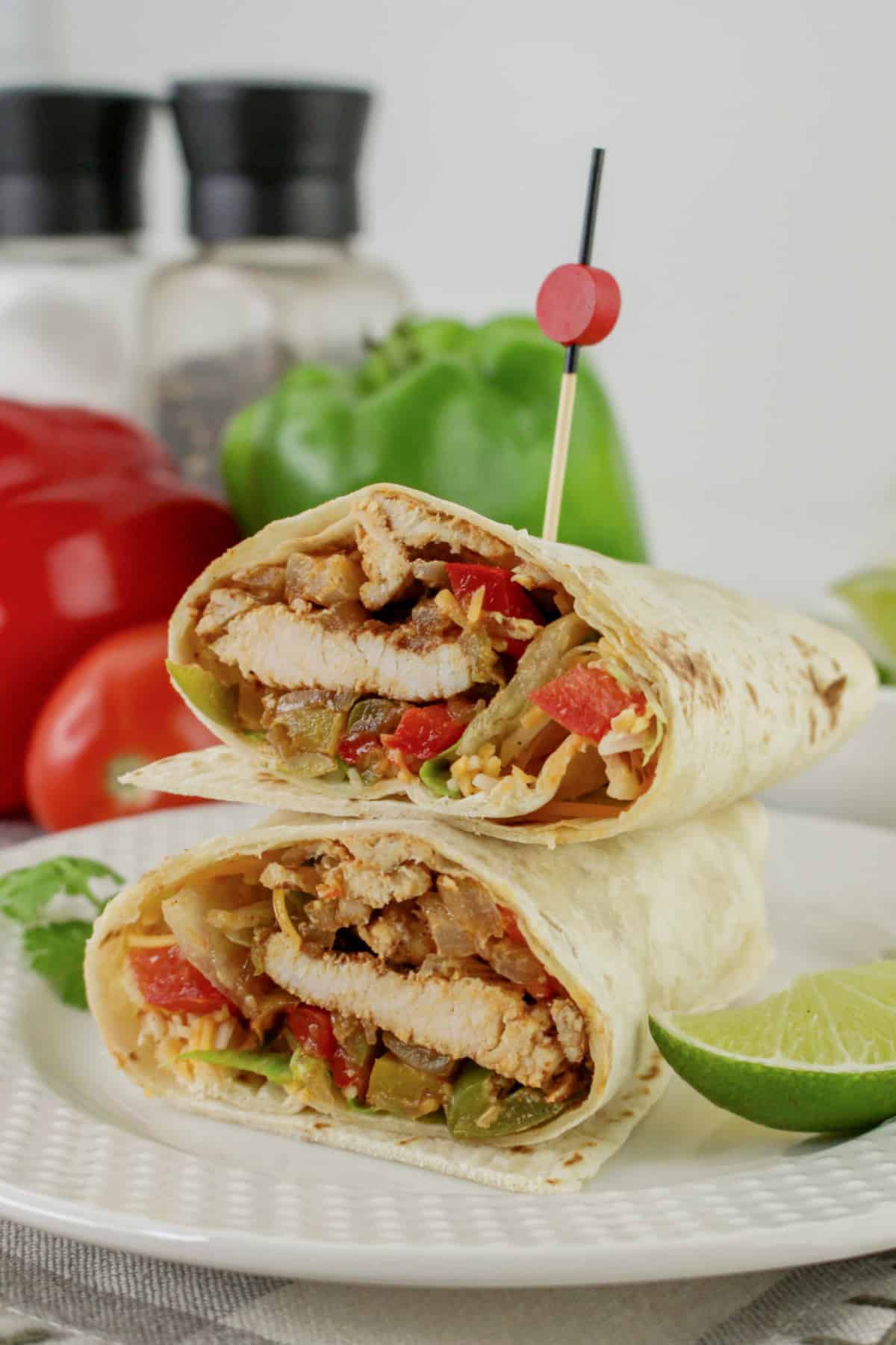 Chicken fajita wrap cut in half.
