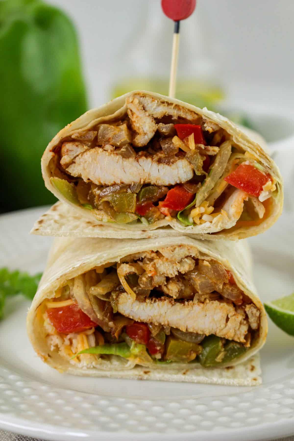 Chicken fajita wrap cut in half.