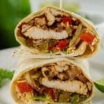 Chicken fajita wrap cut in half.
