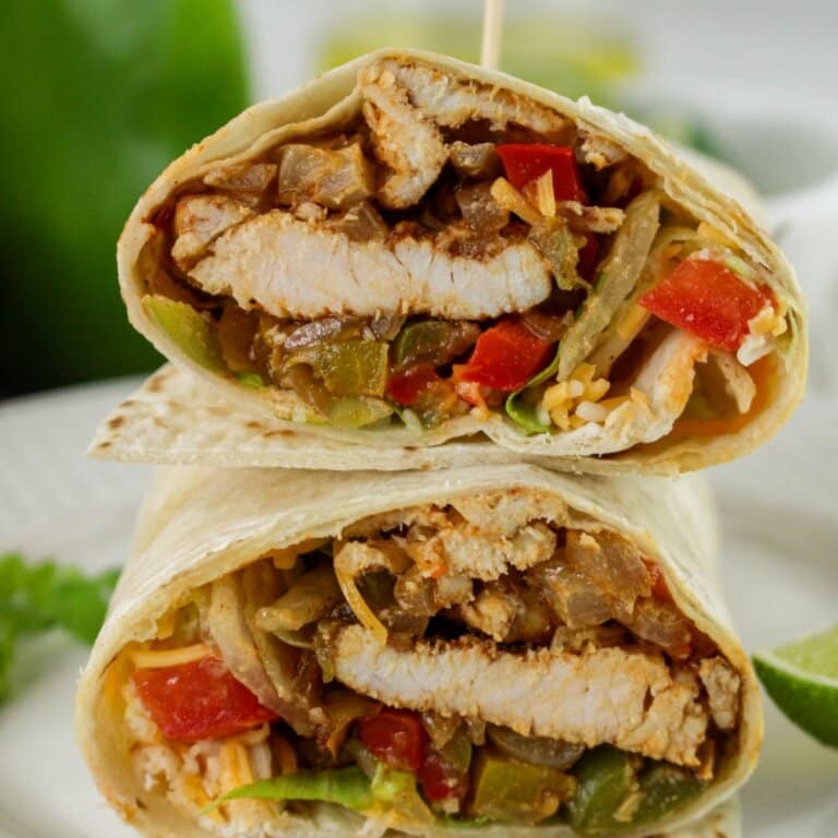 Chicken fajita wrap cut in half.