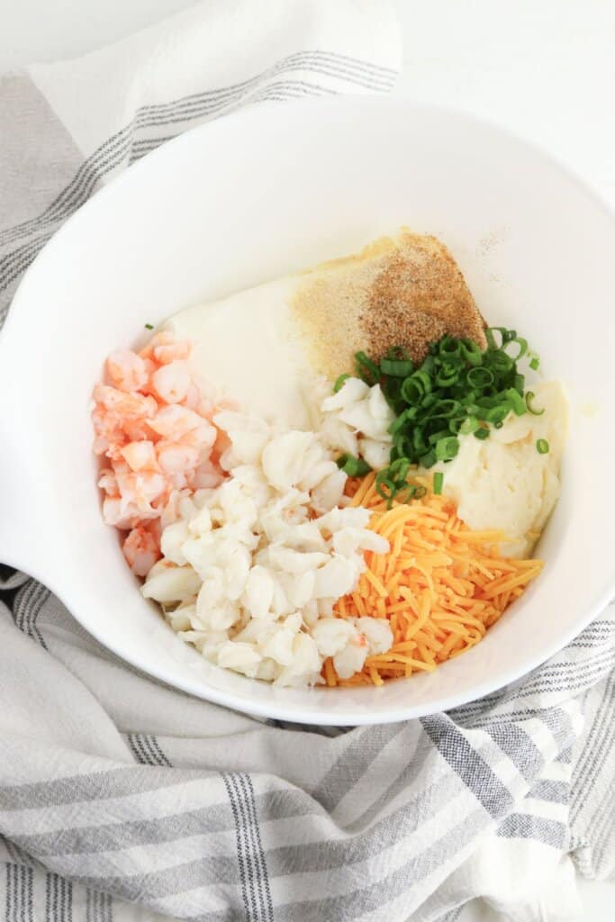 Ingredients being mixed in a white bowl.