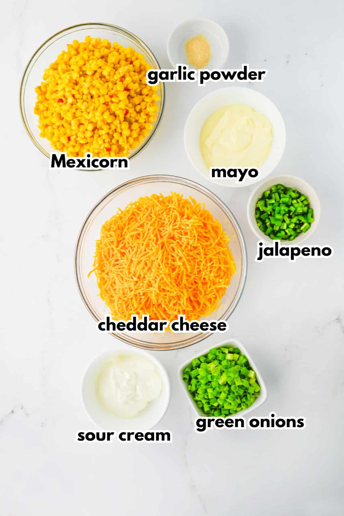Bowls of ingredients on a counter labelled with text.