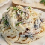 Serving of mushroom pasta on a small plate.