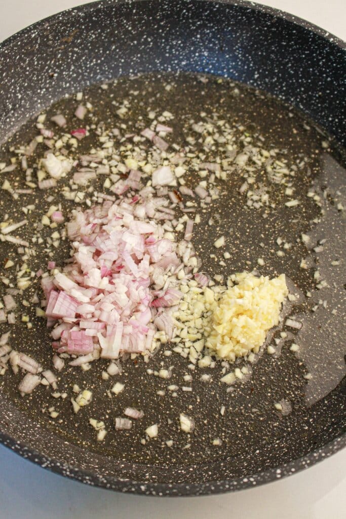 Shallots and garlic in a skillet.