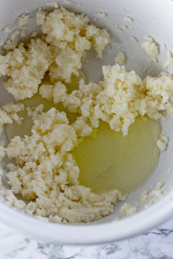 Egg whites being added to butter and sugar.