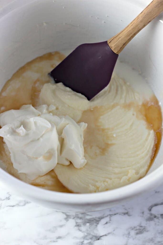 Sour cream being added to batter.