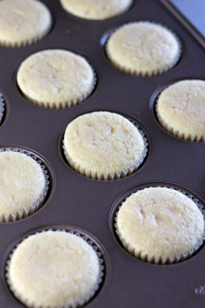 Baked cupcakes in a muffin pan.
