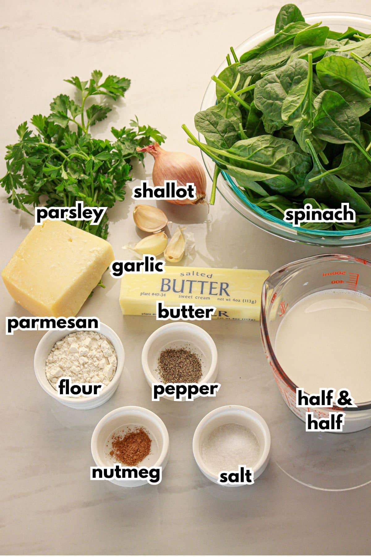Bowls of ingredients labelled with text on a counter.