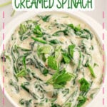 White bowl full of homemade creamed spinach.
