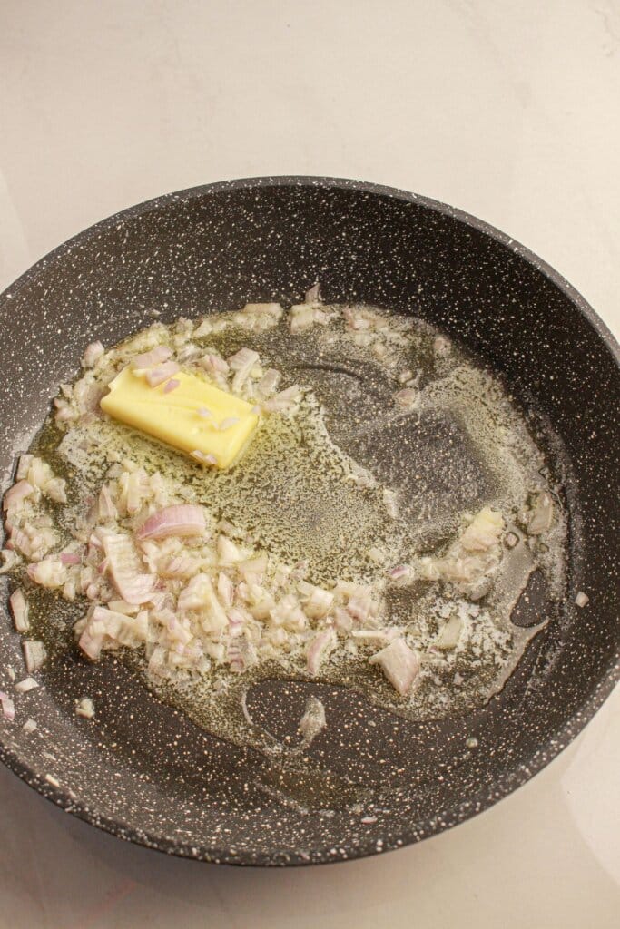 Butter and shallots in a skillet.