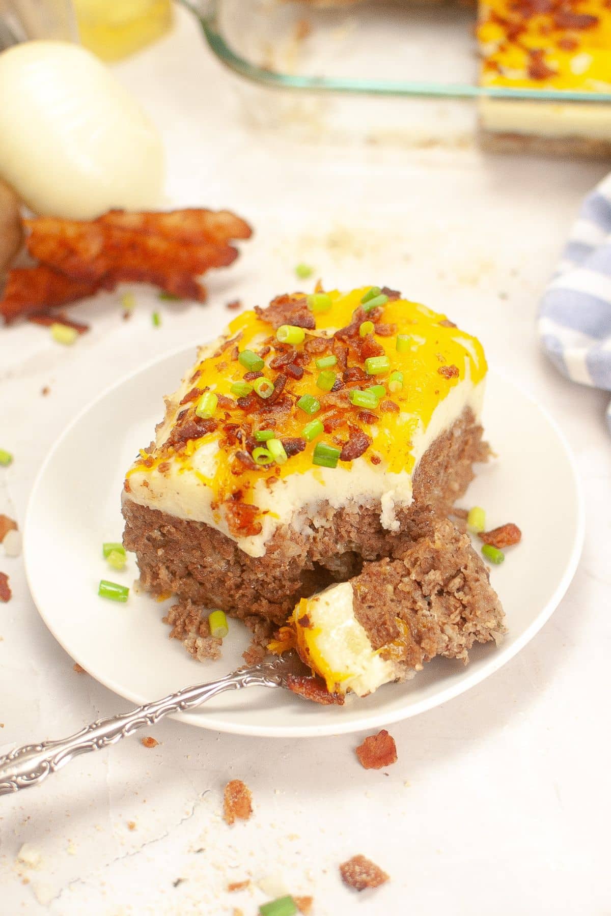 Slice of meatloaf casserole on a small plate.
