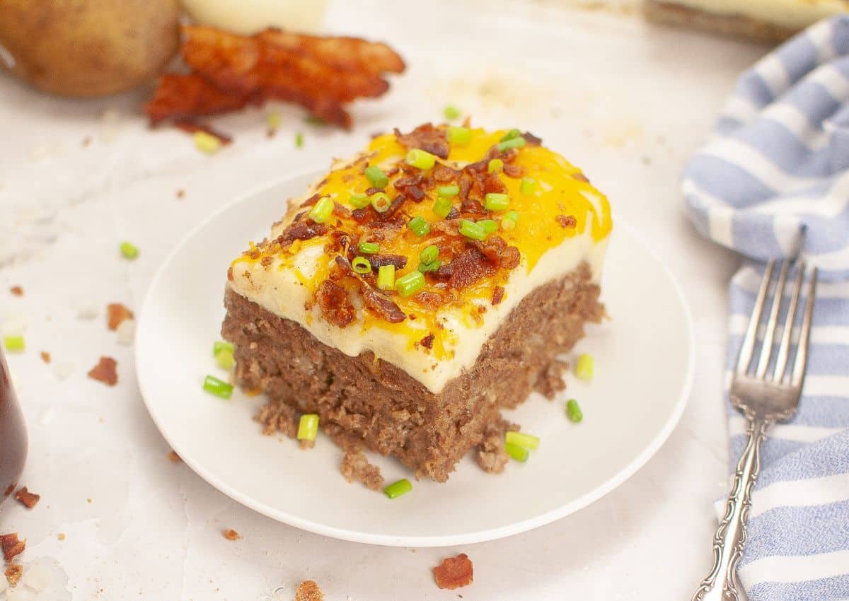 Slice of meatloaf casserole on a small plate.