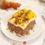 Slice of meatloaf casserole on a small plate.