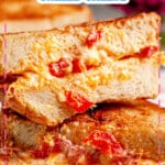 Three pimento grilled cheese sandwiches stack on top of each other.