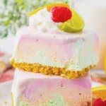 Two rainbow sherbet bars stacked on top of each other.