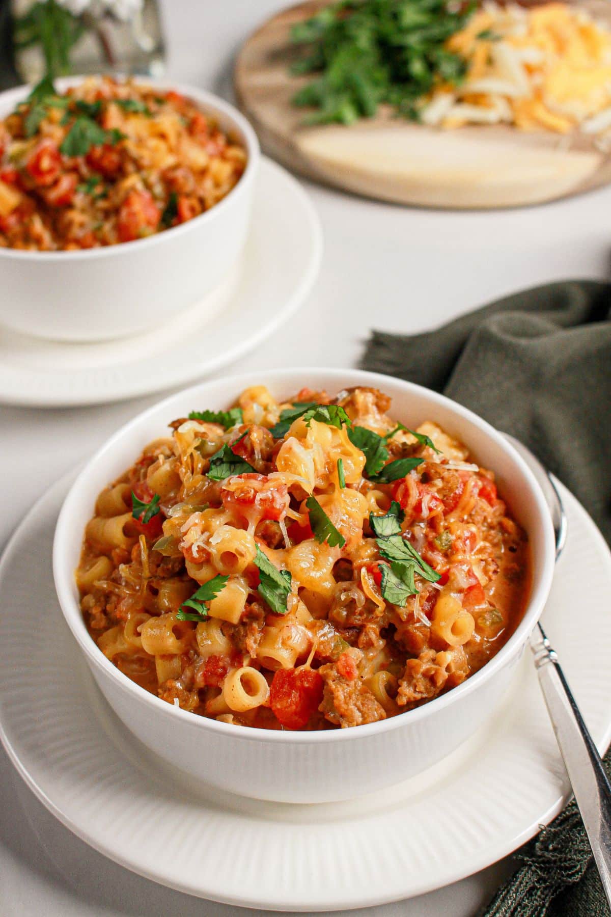 White bowl filled with slow cooker taco pasta.