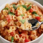 White bowl filled with slow cooker taco pasta.