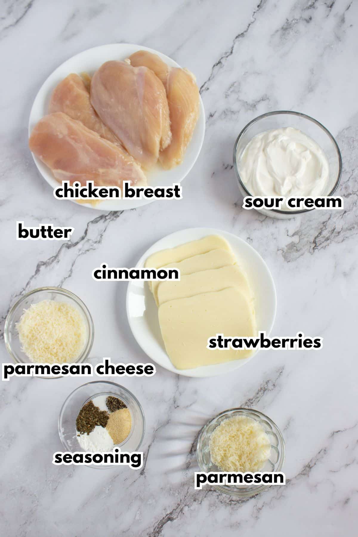 Bowls of ingredients labelled with text on a counter.
