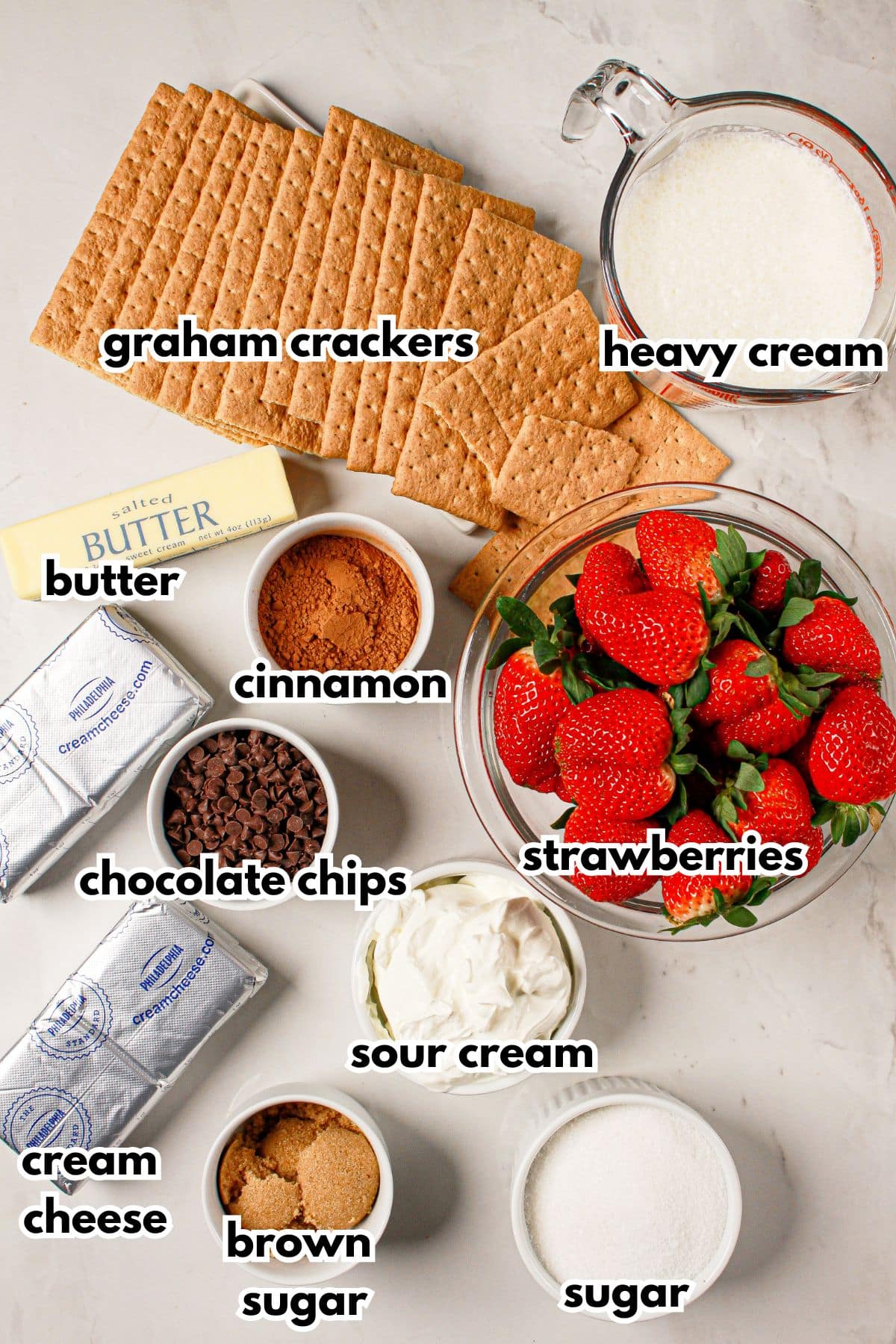 Bowls of ingredients labelled with text on a counter.