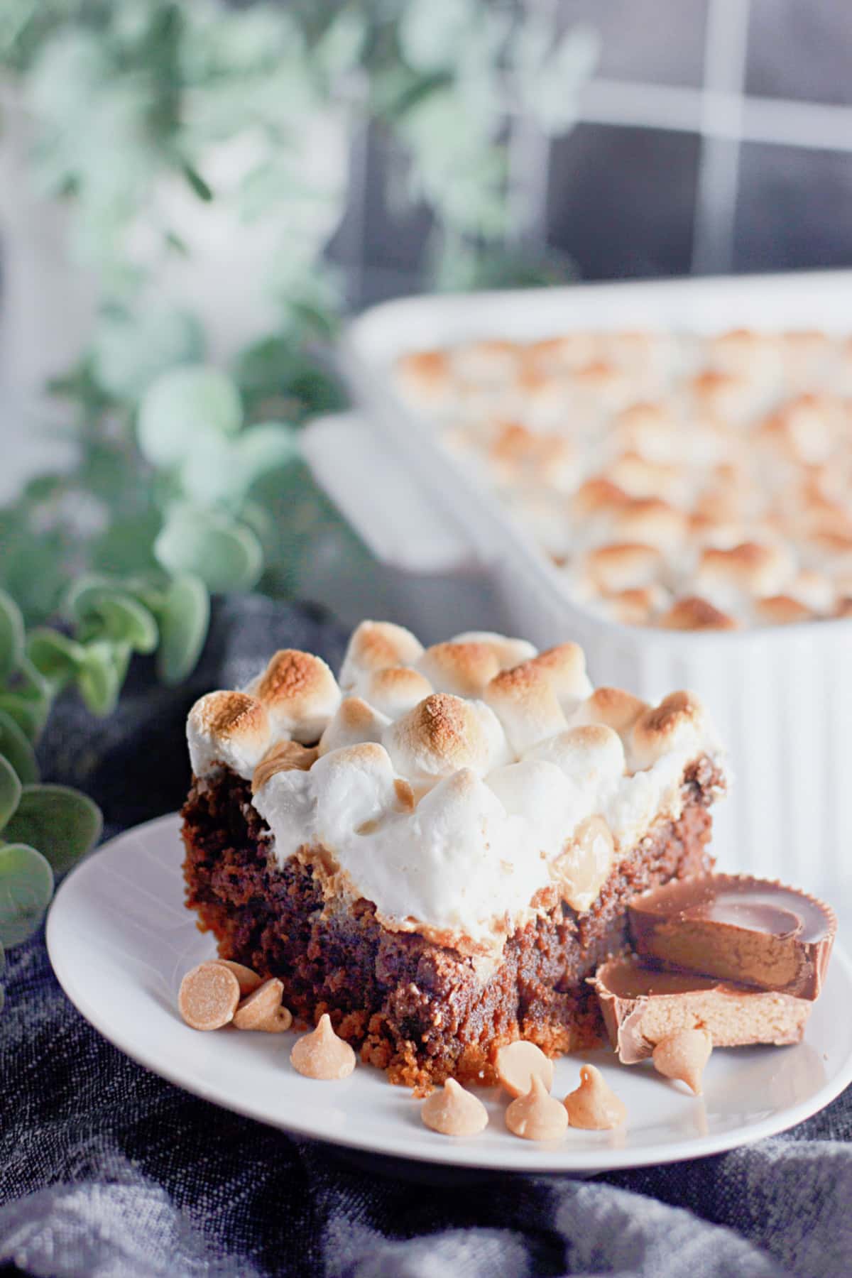 Slice of smores brownies on a plate.