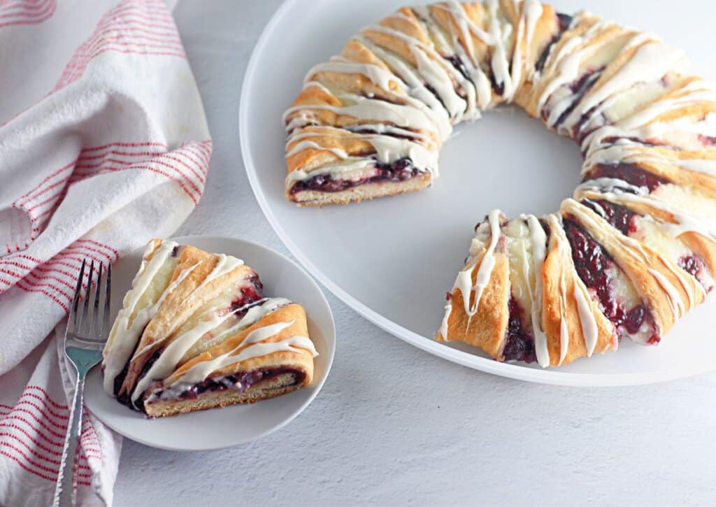 Berry crescent ring with a slice missing.