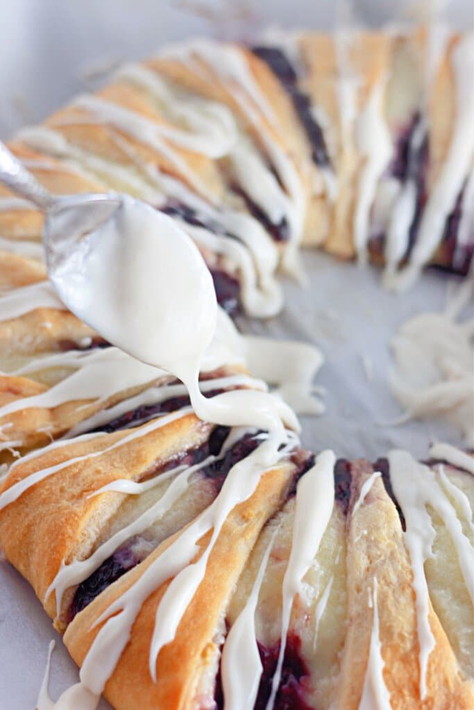 Drizzle being poured on top of baked goods.