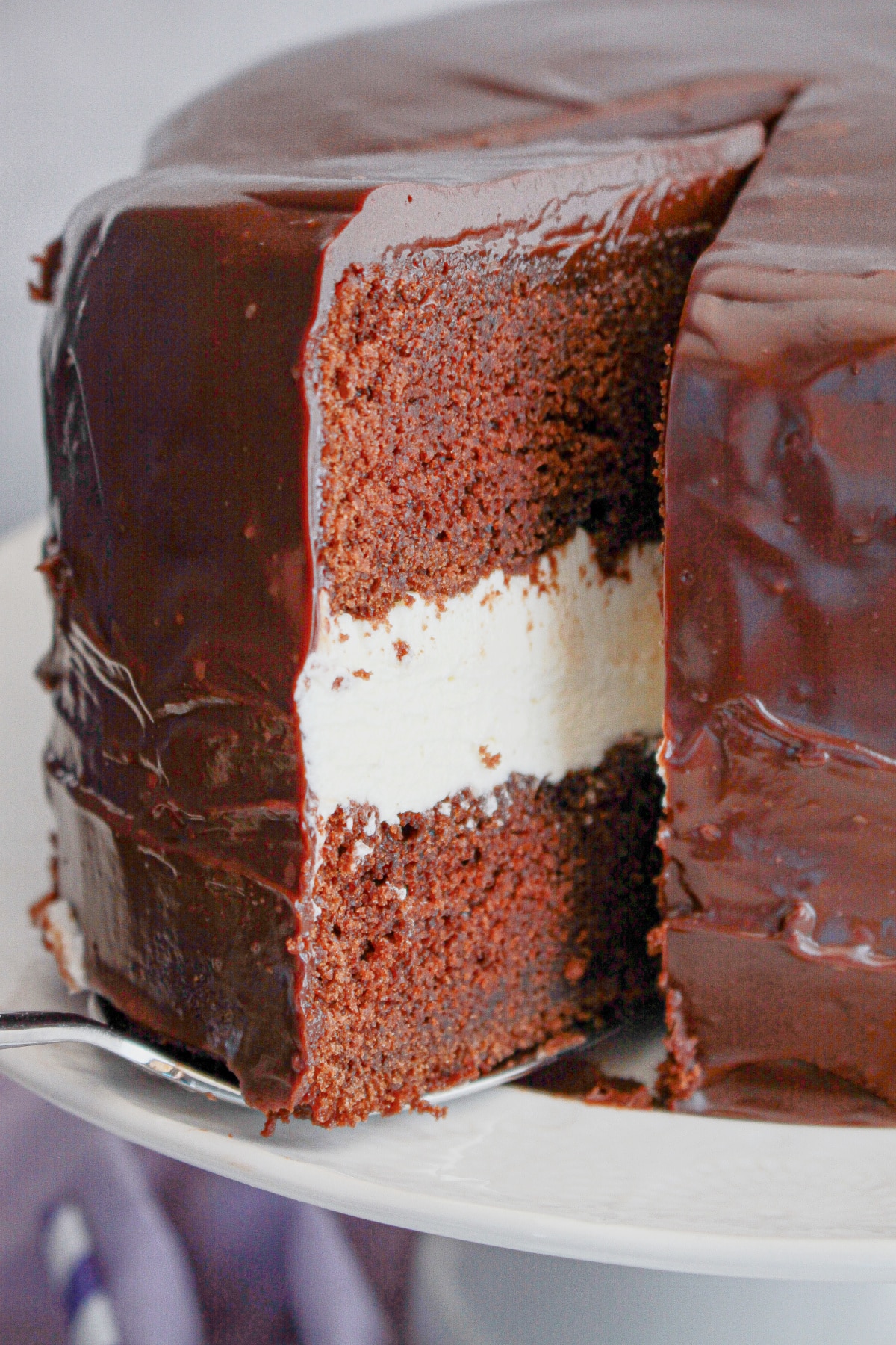 Slice of ding dong cake on a small plate.