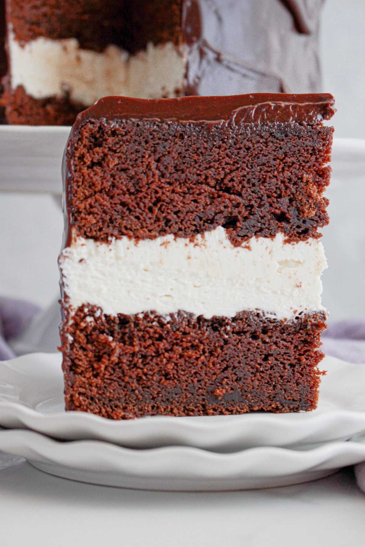 Slice of ding dong cake on a small plate.