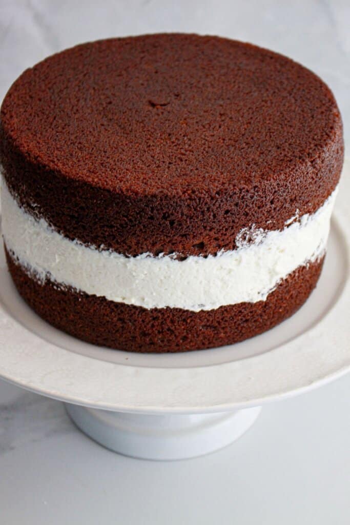 Cake layers being stacked on top of each other.