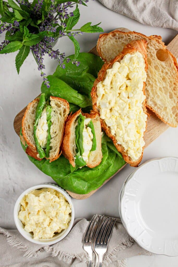 Sandwiches on a wooden cutting board.