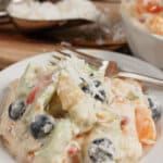 White bowl full of Hawaiian Cheesecake Salad.