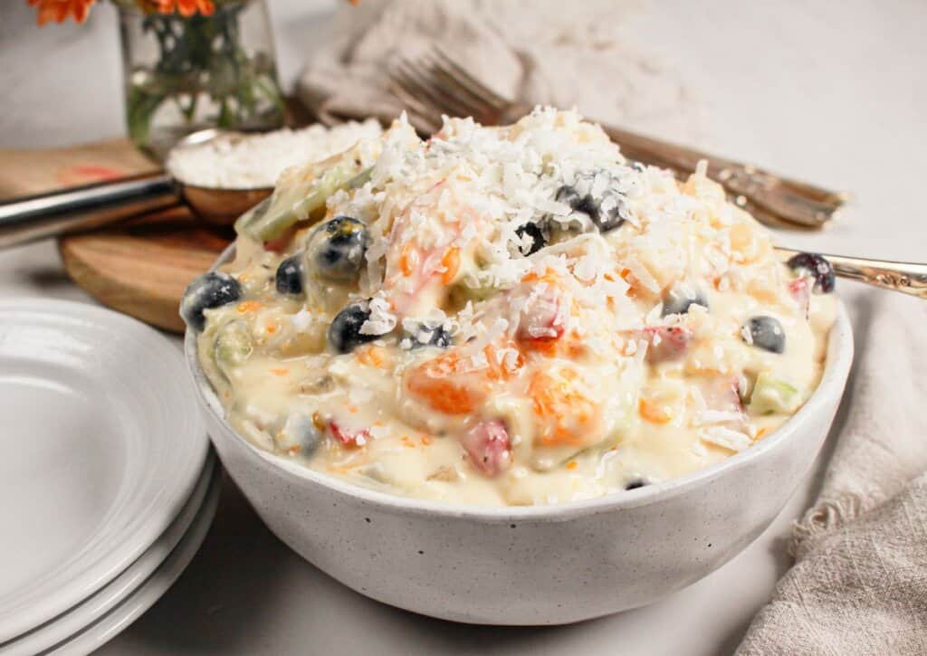 White bowl full of Hawaiian Cheesecake Salad.