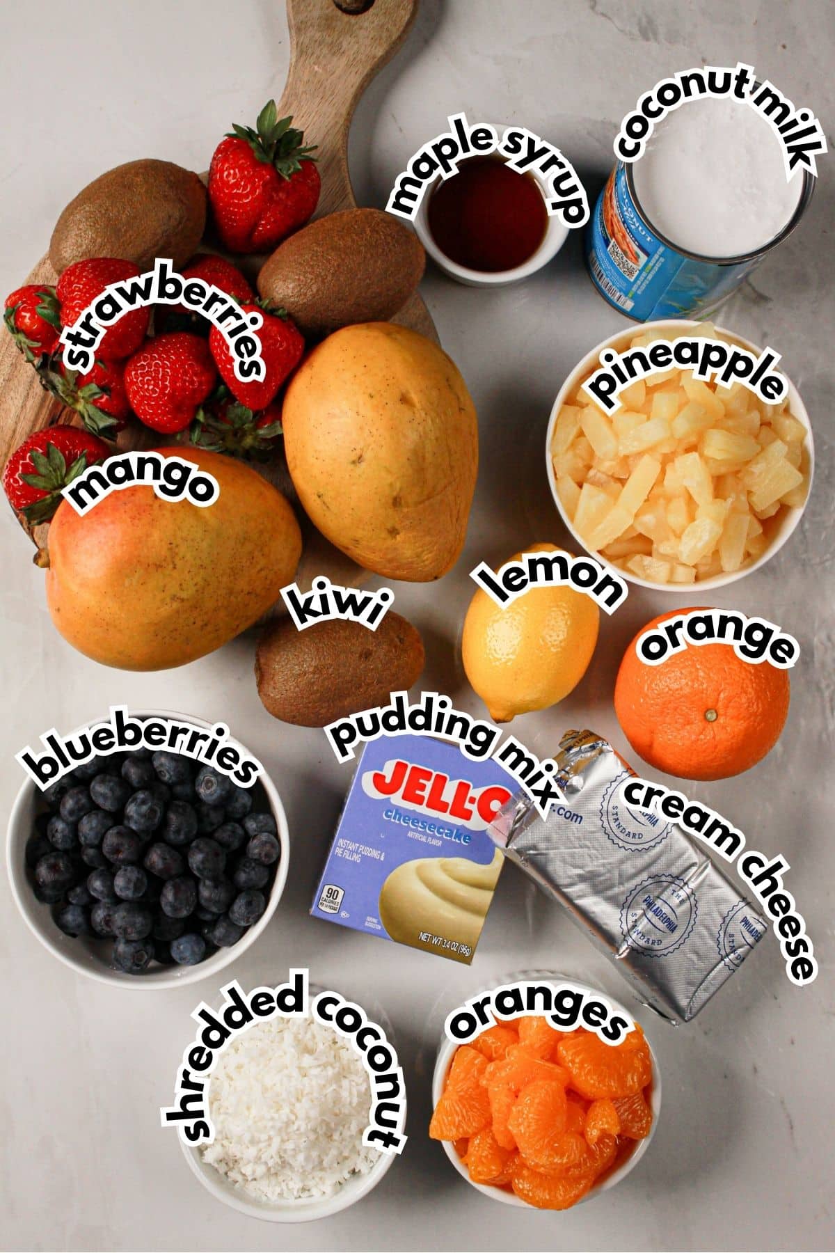 Bowls of ingredients labelled with text on a counter.
